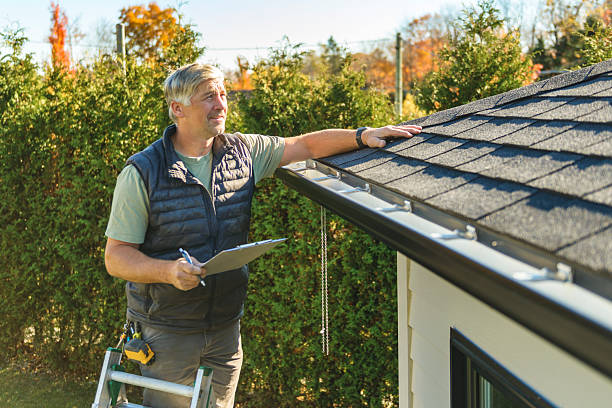 Professional Roofing technician working in Iola, KS